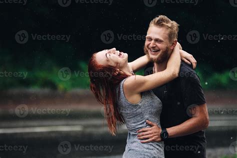 beautiful couple hugging in the rain 11446432 Stock Photo at Vecteezy