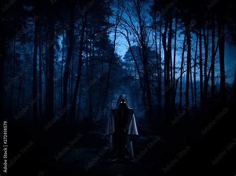 Ghost in a dark forest - spooky, horror or ufo concept Stock Photo ...