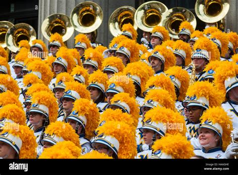 Members Of The West Virginia University Mountaineer Marching Band Pose