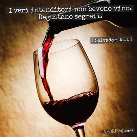 red wine being poured into a glass