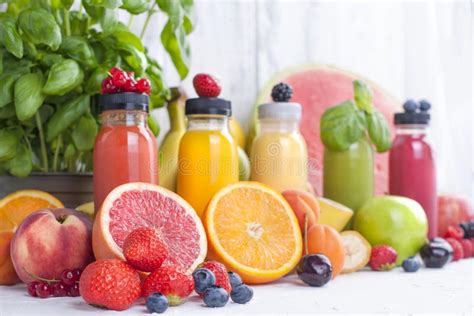 Many Different Fruits And Berries Juice In Bottles Vitamins And