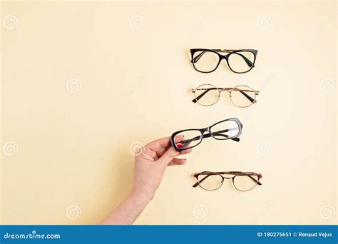 Woman Hand Holding Eyeglasses Optical Store Glasses Selection Eye Test Vision Examination At