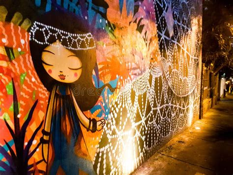 Street Graffiti of a Cartoon Girl on an Illuminated Wall in Sao Paulo ...