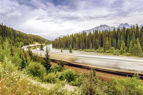 Train Passing by Banff National Park, Alberta, Canada Stock Photo ...