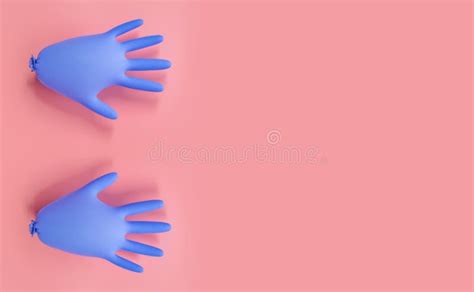 Inflated Blue Glove And Gloved Hand Injecting A Liquid With A Syringe