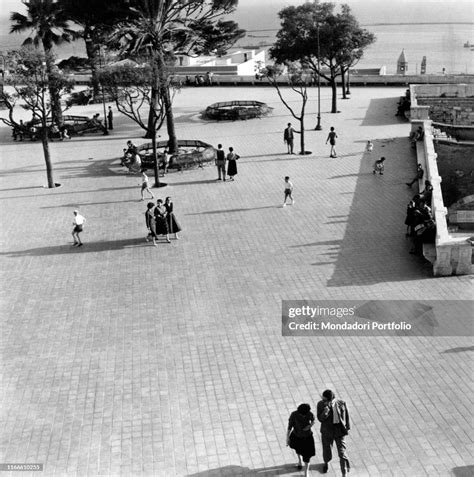 Some People Walking At The Embankment Of Cagliari Cagliari Maggio