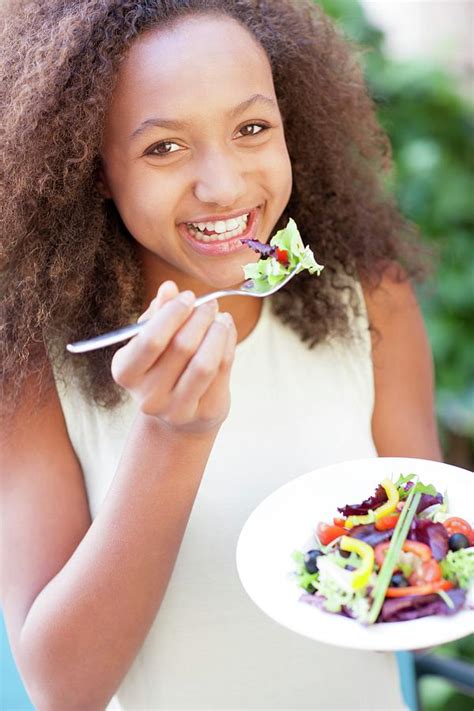 Teenage Girl Eating A Salad Photograph By Ian Hooton Science Photo Library