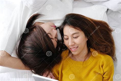 Young Cute Asian Lesbian Couple Using Tablet With Happiness On W Stock Image Image Of People