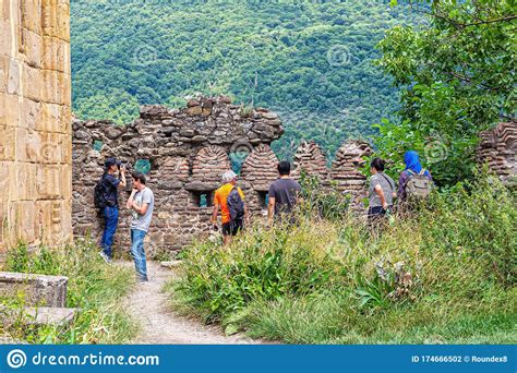 Group Of Tourists At The Fortress Wall Of The Ancient Ananuri Castle