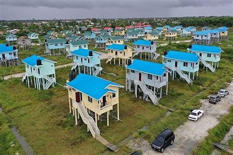 Guyana Eleven Moderate Income Families Now Proud Homeowners