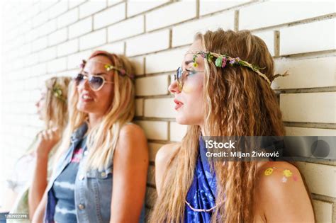 Three Beautiful Caucasian Women Standing By White Brick Wall Sisters Or