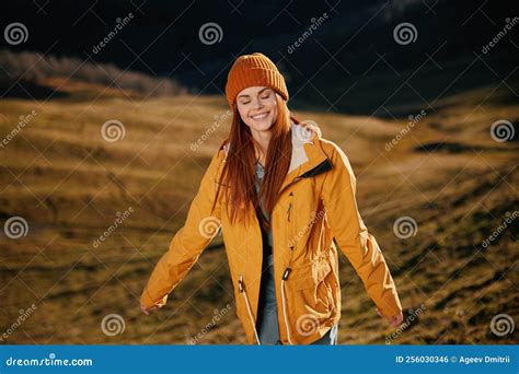 Woman Running Up The Hill To The Camera Smile With Teeth In The