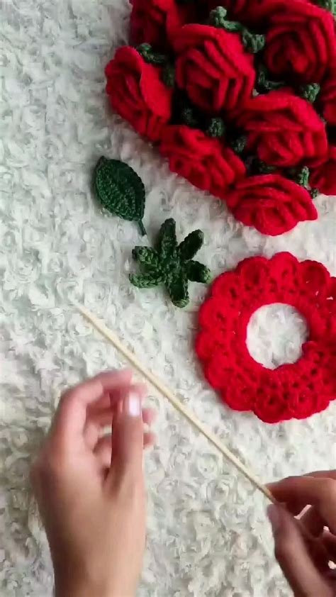 Crocheted Red Roses Are Being Worked On By Someone