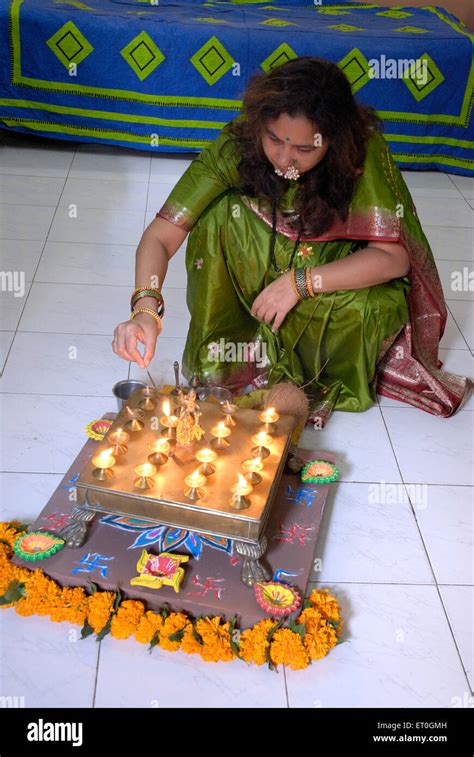 Lady performing deep puja on balipratipada fist day of Hindu on Diwali ...