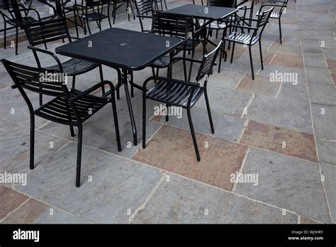 Tables and chairs at outdoor cafe Stock Photo - Alamy