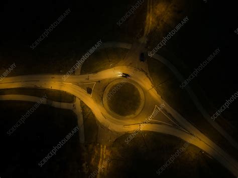 Aerial view of car driving by night on roundabout, Estonia - Stock Image - F039/6789 - Science ...