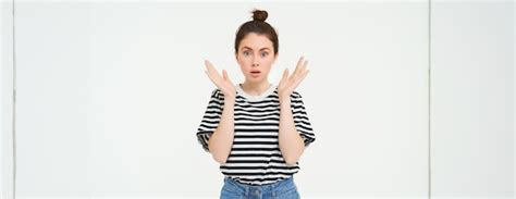 Free Photo Portrait Of Surprised Woman Gasping Looking Amazed Hear