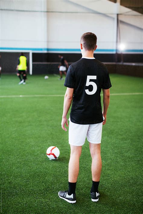 Soccer Player Training In Football Field By Stocksy Contributor