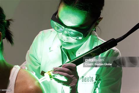 A Pulse Of Laser Illuminates Nurse Elizabeth Schlesinger Right As