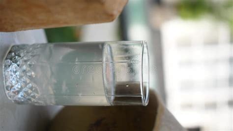 Coconut Water Pouring From Fresh Whole Coconut Into Glass Stock Video