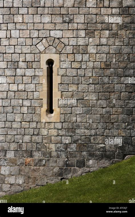 arrow slits in the walls of Windsor Castle Stock Photo: 9300582 - Alamy