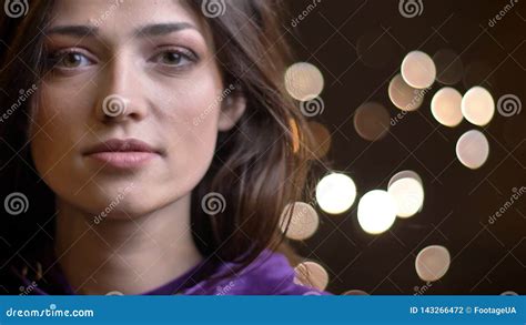 Close Up Portrait Of Pretty Caucasian Brunette Girl Watching Intently