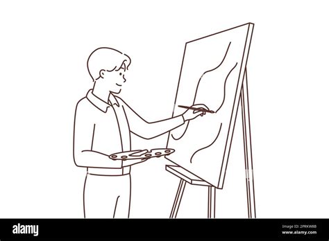 Young man painting picture on easel. Happy male artist enjoy drawing on ...