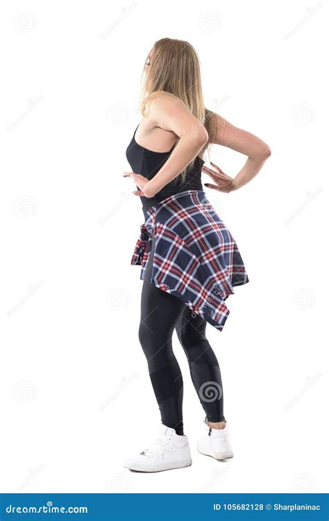 Rear Profile View Of Young Blonde Woman Dancing Jazz Dance With