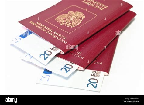 Three Red Russian Passports And Euro Cash Twenty Banknotes In Each