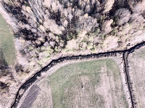 Drone Image Aerial View Of Rural Area With Wawy River Ion Fores Stock