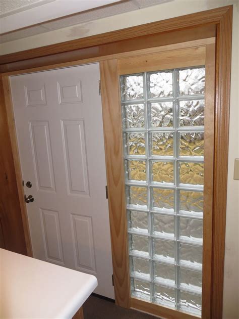 The After Shot Showing A New Steel Entry Door With Glass Block