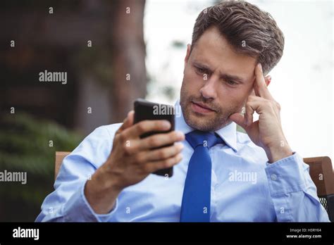 Businessman Using Mobile Phone Stock Photo Alamy