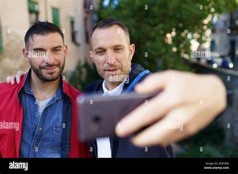 Gay Couple Making A Selfie With Their Smartphone Stock Photo Alamy