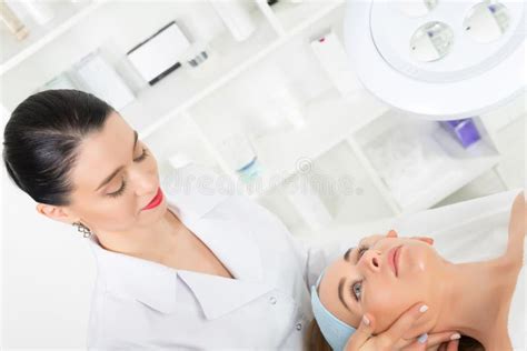 Female Beautician Doctor With Patient In Wellness Center Professional