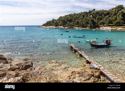 Fishing Boats Parked In A Bay With Transparent Waters In Stoja Near