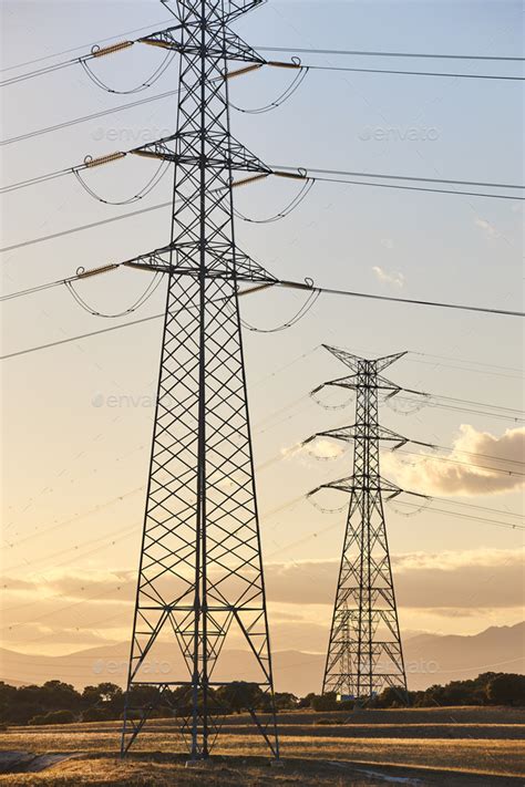 Power lines at sunset. Energy industry. Electricity distribution ...