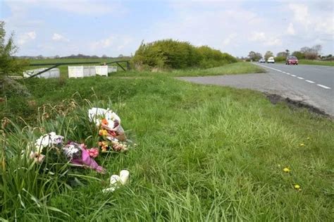 Floral Tributes Left At The Scene Of Fatal Crash Where Two People