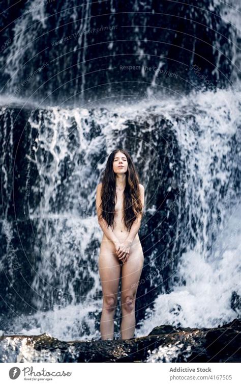 Naked Woman Near Waterfall In Summer A Royalty Free Stock Photo From