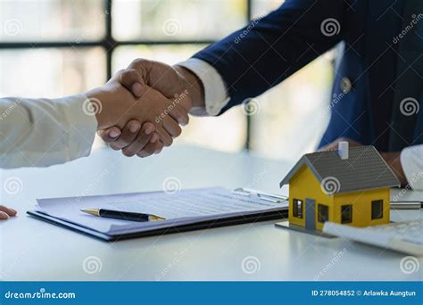 Successful Handshake And Agreement Real Estate Agent And Client