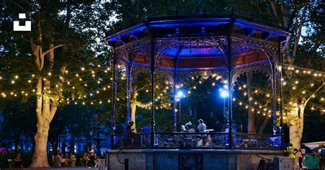 ornate bandstand illuminated  blue lights  string lights photo