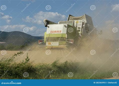 The Modern Combine Harvester Harvesting Ripe Wheat Grains Agricultural