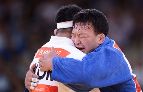 Olympics Day 6 Mongolias Tuvshinbayar Naidan Blue Celebrates After