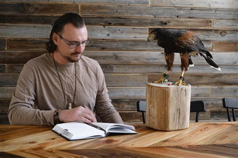 Premium Photo Man Is Working Writing With Wild Eagle Bird