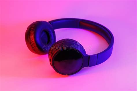 Stylish Black Wireless Headphones Lit With Colorful Neon Light On