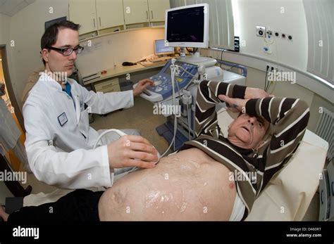 A Doctor Checks A Monitor After Performing An Endoscopic Procedure On A