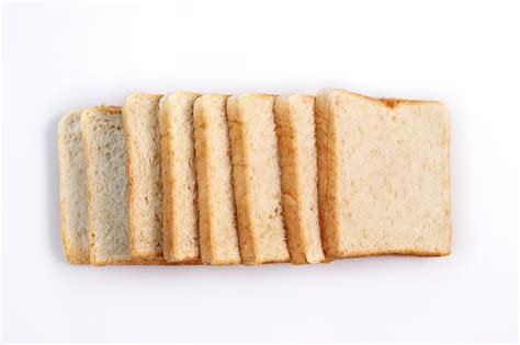 Premium Photo High Angle View Of Bread In Plate Against White Background