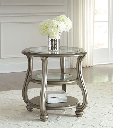 Coralayne Silver Round End Table from Ashley (T820-6) | Coleman Furniture