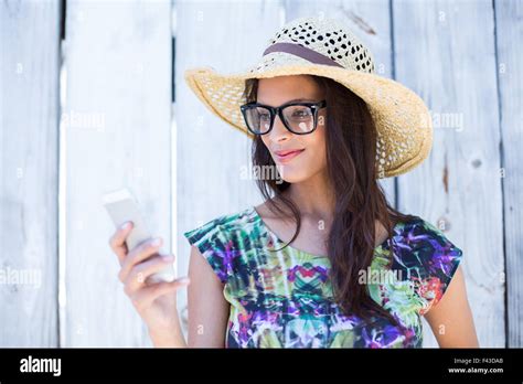 Smiling Beautiful Brunette Using Her Phone Stock Photo Alamy
