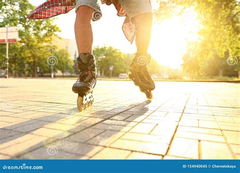 Young Man Roller Skating On Sunny Day Closeup Recreational Activity