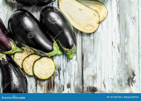 Whole Eggplants And Slice Of Eggplant Stock Photo Image Of Ripe